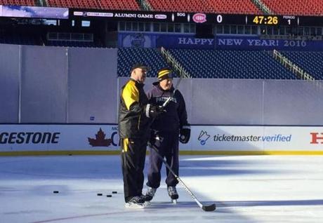 Bruins coach Claude Julien (left) and Patriots coach Bill Belichick skated together on the Winter Classic rink installed at Gillete Stadium on Thursday, Dec. 31, 2015. (Courtesy Boston Bruins)
