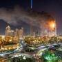 epa05084847 A general view of flames and smoke billowing from the building after fire broke out at The Address Hotel in Dubai, UAE. 31 December 2015. Media reports state that there is no immediate news of casualties. EPA/NICOLAS CORNET