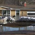 A house sat flooded at the end of Electra Drive in Arnold, Mo.,