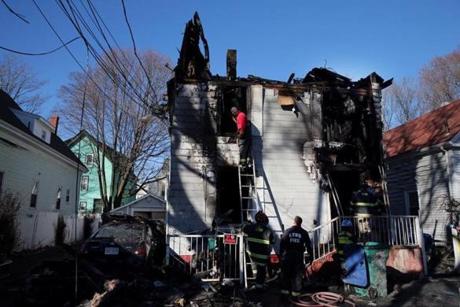 Firefighters continued to work at the scene of a fatal house fire in Lynn, MA on Christmas eve. 
