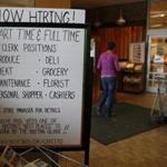A handwritten sign reading, ?Now Hiring!? was seen inside of the Roche Bros. store in Acton, Mass. last October.