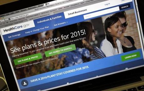 The HealthCare.gov website, where people can buy health insurance, was displayed on a laptop screen. 
