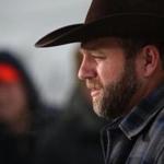 Ammon Bundy, the leader of an anti-government militia, spoke to members of the media in front of the Malheur National Wildlife Refuge Headquarters Tuesday. 
