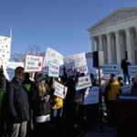 Demonstrators participated in a rally at the Supreme Court Monday.