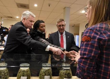 State Senators John F. Keenan, Linda Dorcena Forry, and Michael J. Rodrigues gestured to products at RiverRock Cannabis in Denver Tuesday.
