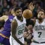 Boston Celtics center Jared Sullinger (7) and forward Amir Johnson (90) react to the ball under the defensive boards during the first quarter of an NBA basketball game against the Phoenix Suns, Friday, Jan. 15, 2016, in Boston. (AP Photo/Stephan Savoia)