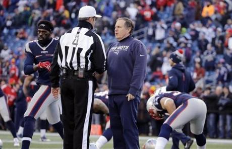 Referee Craig Wrolstad (4) spoke to New England Patriots head coach Bill Belichick before the game.
