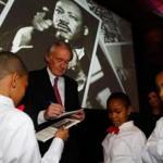 Senator Edward J. Markey signed autographs Monday for members of the St. Cyprian?s Celestial Infernos Steel Orchestra at the Martin Luther King Jr. breakfast in Boston. Nearly 1,000 people attended the annual event at the Boston Convention & Exhibition Center. In a speech, Markey called for reform on issues such as voting rights, education, wages, and drug rehabilitation.