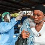 A woman had her temperature taken as part of Ebola prevention, before entering the Macauley government hospital in Freetown, Sierra Leone, on Thursday.