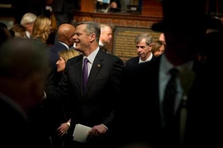 Massachusetts Governor Charlie Baker greeted members of the Legislature as he walked through the chambers of the State House.

