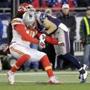 New England Patriots' Danny Amendola (80) hits Kansas City Chiefs' Jamell Fleming (30) in the first half of an NFL divisional playoff football game, Saturday, Jan. 16, 2016, in Foxborough, Mass. (AP Photo/Steven Senne)