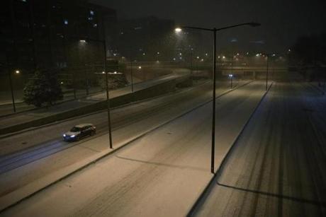 In Washington D.C., the I-395 was covered by snow with little traffic Friday night.
