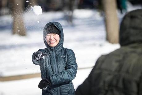Tina Zeng tossed a snow ball in the Boston Public Garden.
