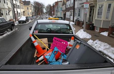 City workers collected space savers Tuesday.
