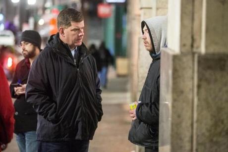 01/27/2016 BOSTON, MA Mayor Marty Walsh (cq) (left) speaks with Roger Gordon (cq) 29, a homeless man, near downtown crossing during the annual homeless census. (Aram Boghosian) 
