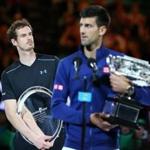 MELBOURNE, AUSTRALIA - JANUARY 31: Australian Open champion Novak Djokovic of Serbia holds the Norman Brookes Challenge Cup as Andy Murray of Great Britain looks on after the Men's Singles Final during day 14 of the 2016 Australian Open at Melbourne Park on January 31, 2016 in Melbourne, Australia. (Photo by Scott Barbour/Getty Images)