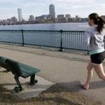 A runner made her way along a path next to the Charles River Monday. 