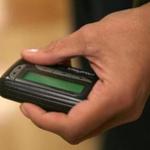 Yvette Hall-Swain, a nurse manager in emergency services at South Shore Hospital in Weymouth, held a pager. About 85 percent of hospitals still rely on the devices, analysts said.