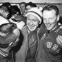 Jack Riley (right), coach of the US hockey team, hugged Russian team captain Nikolai Sologubov at the 1960 Games.