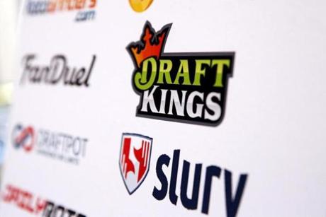A DraftKings logo is displayed on a board inside of the DFS Players Conference in New York last fall.
