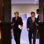 German Chancellor Angela Merkel (left) and Turkish Prime Minister Ahmet Davutoglu arrived for a joint news conference in Ankara, Turkey, Monday.