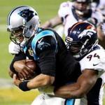 DeMarcus Ware wrapped up Panthers quarterback Cam Newton for one of his two sacks.