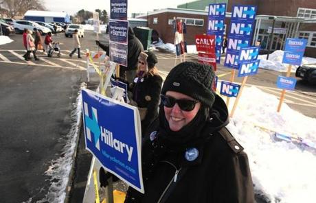 Hillary Clinton supporter Julie Moore greeted voters at Winnacunnet High School in Hampton, N.H.
