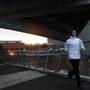 Charlestown, MA - 2/11/2016 - The sun rises as a runner crosses a bridge in Charlestown, MA February 11, 2016. Jessica Rinaldi/Globe Staff Topic: 12capitalNH Reporter: 