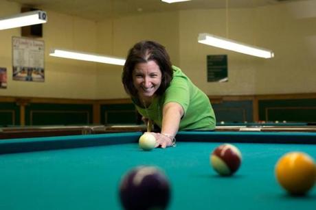 Angela Nuss at Olindy?s, a Quincy spot where the Braintree resident recently hosted a billiards parties for singles.

