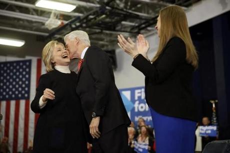 Former President Bill Clinton kissed his wife, Hillary Clinton, on the cheek at a rally in in Hooksett, N.H., on Tuesday. 

