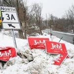 Campaign signs still lined the road in Hooksett, N.H., the day after the first-in-the-nation primary.