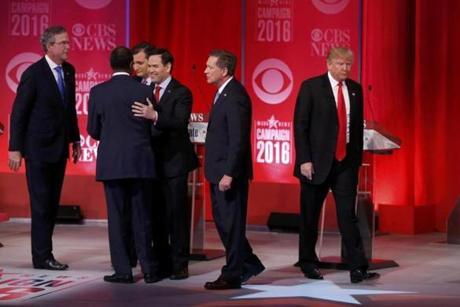 Candidates mingled on stage Saturday at the conclusion of the debate.
