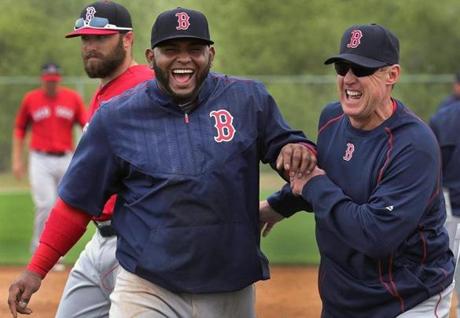 Fort Myers, FL - 02/27/15 - Boston Red Sox Third Base Coach Brian Butterfield (55) and Boston Red Sox third baseman Pablo Sandoval (48) share a laugh during today's workout. Red Sox Spring Training. (Barry Chin/Globe Staff), Section: Sports, Reporter: Peter Abraham, Topic: 28Red Sox, LOID: 8.0.2826364469. 
