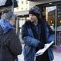 ONE TIME USE ONLY for 12Maine- PORTLAND, ME - JANUARY 21: Brandon Scott, right, speaks with Joyce Lorraine, as he works to collect signatures on a petition regarding a casino referendum Thursday, Jan. 21, 2016 in Monument Square in Portland, Maine. (Joel Page/Portland Press Herald)