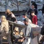 A stretcher was carried amid debris after a hospital was hit by airstrikes near Maarat al-Noaman in Syria?s north Monday.