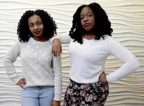 City officials had high praise for seniors Kylie Webster-Cazeau (left), 18, and Meggie Noel, 17, who say there has been too little improvement in conditions at Boston Latin.
