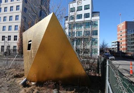 A giant, mysterious golden octahedron that sits in a construction site on the corner of Galileo Galilei Way and Binney St. 
