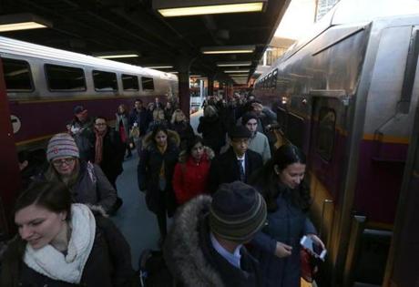 Commuters rushed to board a train leaving for Stoughton and Providence from South Station. 
