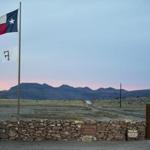 The Texas flag flew Sunday at the entrance to the Cibolo Creek Ranch, where Supreme Court Justice Antonin Scalia was found dead.
