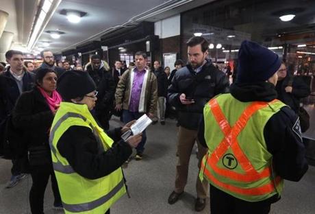 Commuters waited for their connections at Back Bay Station on Thursday night. 

