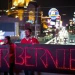 Members of the National Nurses United union chant their slogans while holding LED signs to show their support for Democratic presidential candidate US Senator Bernie Sanders.