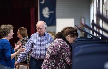 A poll worker assisted a Republican primary voter in South Carolina. 
