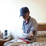 Dwane Foreman, 68, sits in an $80 motel room in East Oakland, Calif. His monthly income is about $500, and he can rarely afford such luxury. 