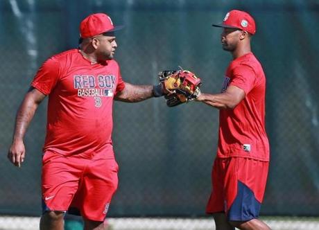 Pablo Sandoval, left, said hello to new teammate Chris Young during his first day at spring training on Sunday.
