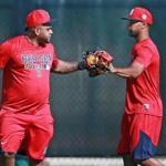 Pablo Sandoval, left, said hello to new teammate Chris Young during his first day at spring training on Sunday.