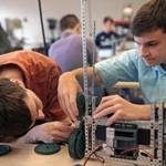 Students Brad Bedarian (left) and Ross Carboni worked on a robotics project at the modern Franklin High School. The new Angier Elementary School in Newton (below) has wireless technology in every classroom. 
