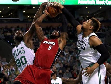Boston, MA - 02/27/16 - (3rd quarter) Boston Celtics forward Amir Johnson (90) and Boston Celtics center Jared Sullinger (7) combine to force a jump ball on Miami Heat forward Amar'e Stoudemire (5) on this shot attempt during the third quarter. The Boston Celtics take on the Miami Heat at TD Garden. - (Barry Chin/Globe Staff), Section: Sports, Reporter: Adam Himmelsbach, Topic: 28Heat-Celtics, LOID: 8.2.1862623082.
