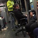 This image of a man lounging in an office chair on the Red Line was posted to Twitter on Saturday.