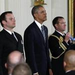 President Obama (center) stood next to Senior Chief Special Warfare Operator Edward Byers Jr. before presenting Byers with the Medal of Honor Monday in a ceremony in the East Room of the White House.