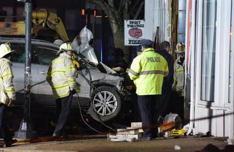 Emergency responders removed the Volkswagen which crashed into a Newton Restaurant, leaving two dead. 
